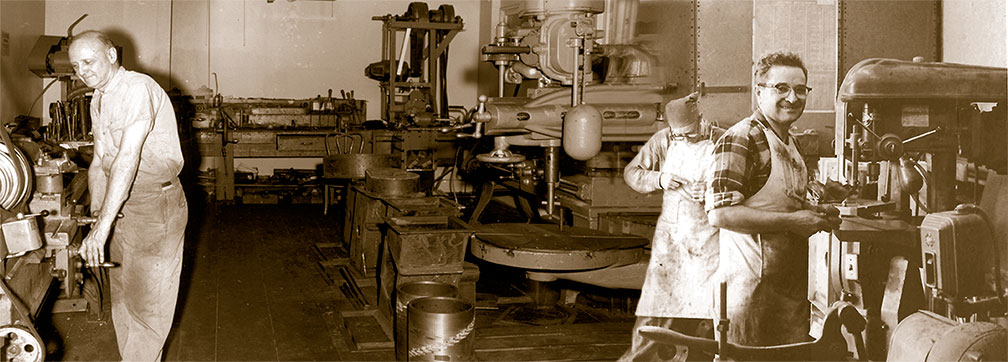 Franklin Miller's original machine shop with workers at lathes and drill presses
